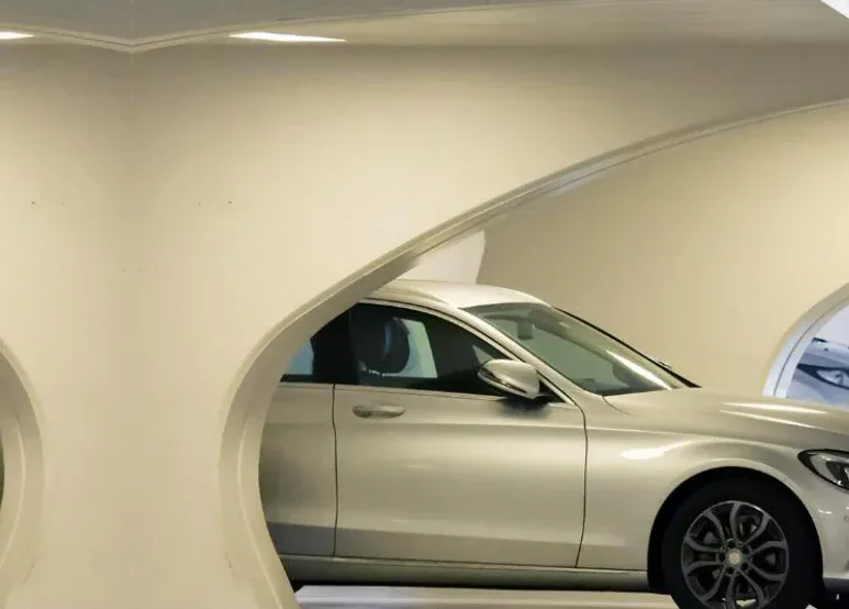 Car parked in a covered parking level. Illustrative image from the developer's catalogue, not the building itself