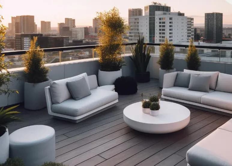 Rooftop terrace with sofas above a city skyline. Illustrative image from the developer's catalogue, not the building itself